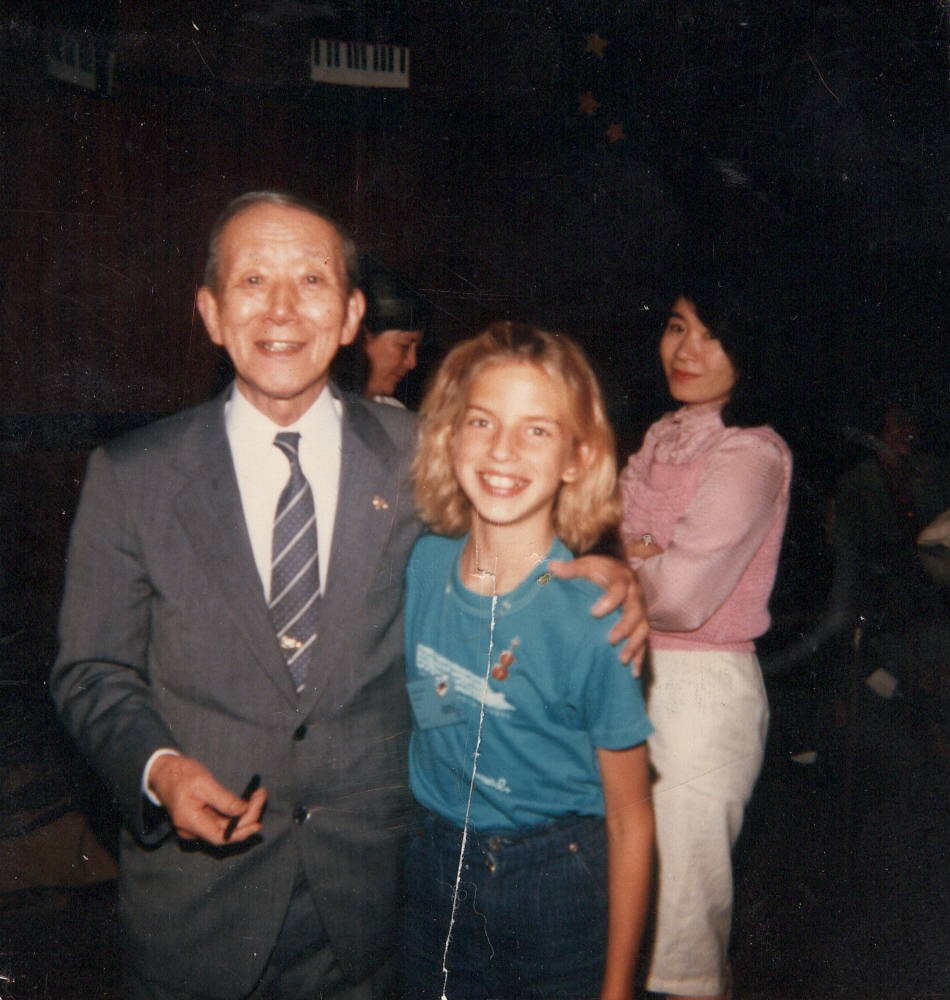 Gretel as a young violin student with Dr. Shinichi Suzuki